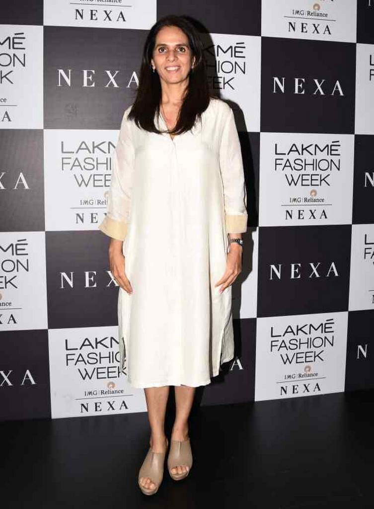 Designer Anita Dongre, gracing the carpet, wearing a classic ivory kurta with beige cuffs and mules.