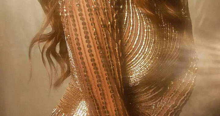 ​Malaika stuns in shimmery golden slit gown​