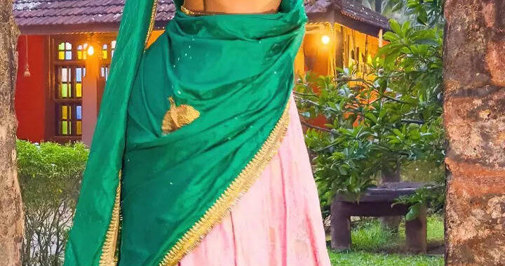 Pooja stuns in green and pink silk lehenga