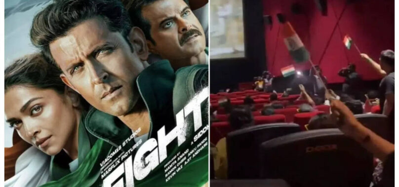 Fighter: Fans wave tricolour flag inside cinema halls